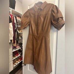Leather like short full snap closure puff sleeve mini dress.